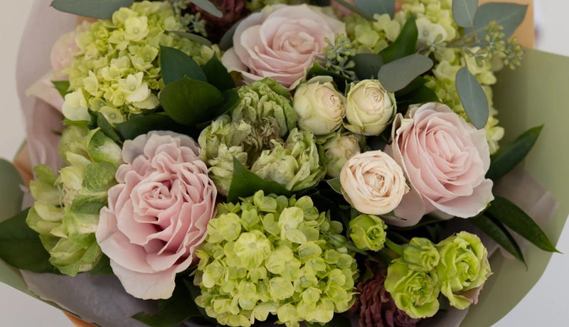 Hand-tied flower bouquet with seasonal blooms from Tooka Florist