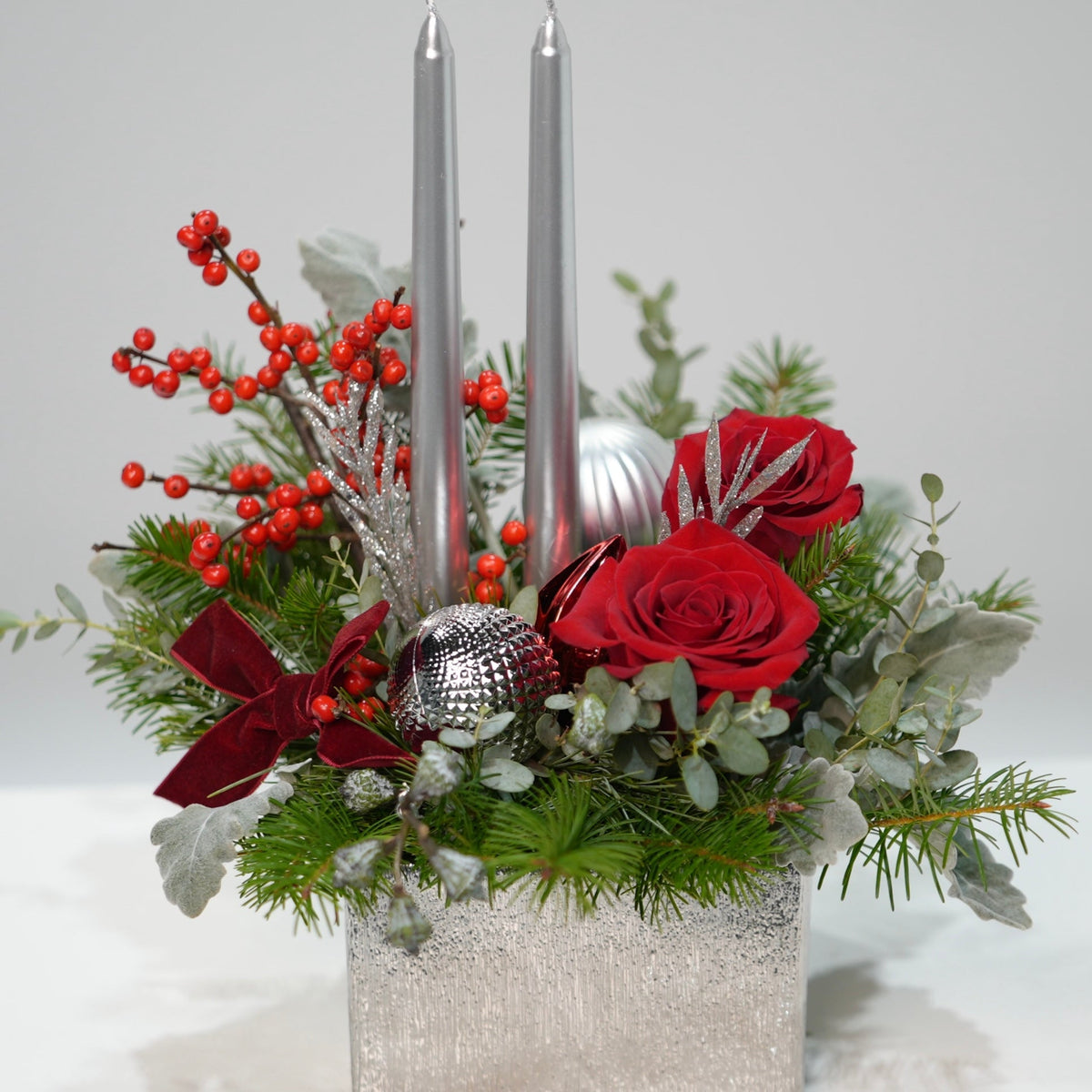 Silver Noel Candle Centerpiece by Tooka Florist – Luxury Flowers Serving North, West & Greater Vancouver