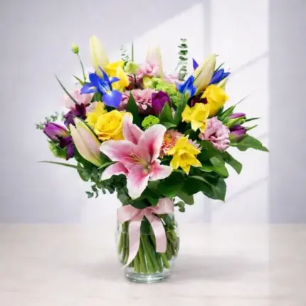 Bright and Light floral arrangement - Pink lilies, blue irises, and yellow roses in clear vase Vancouver